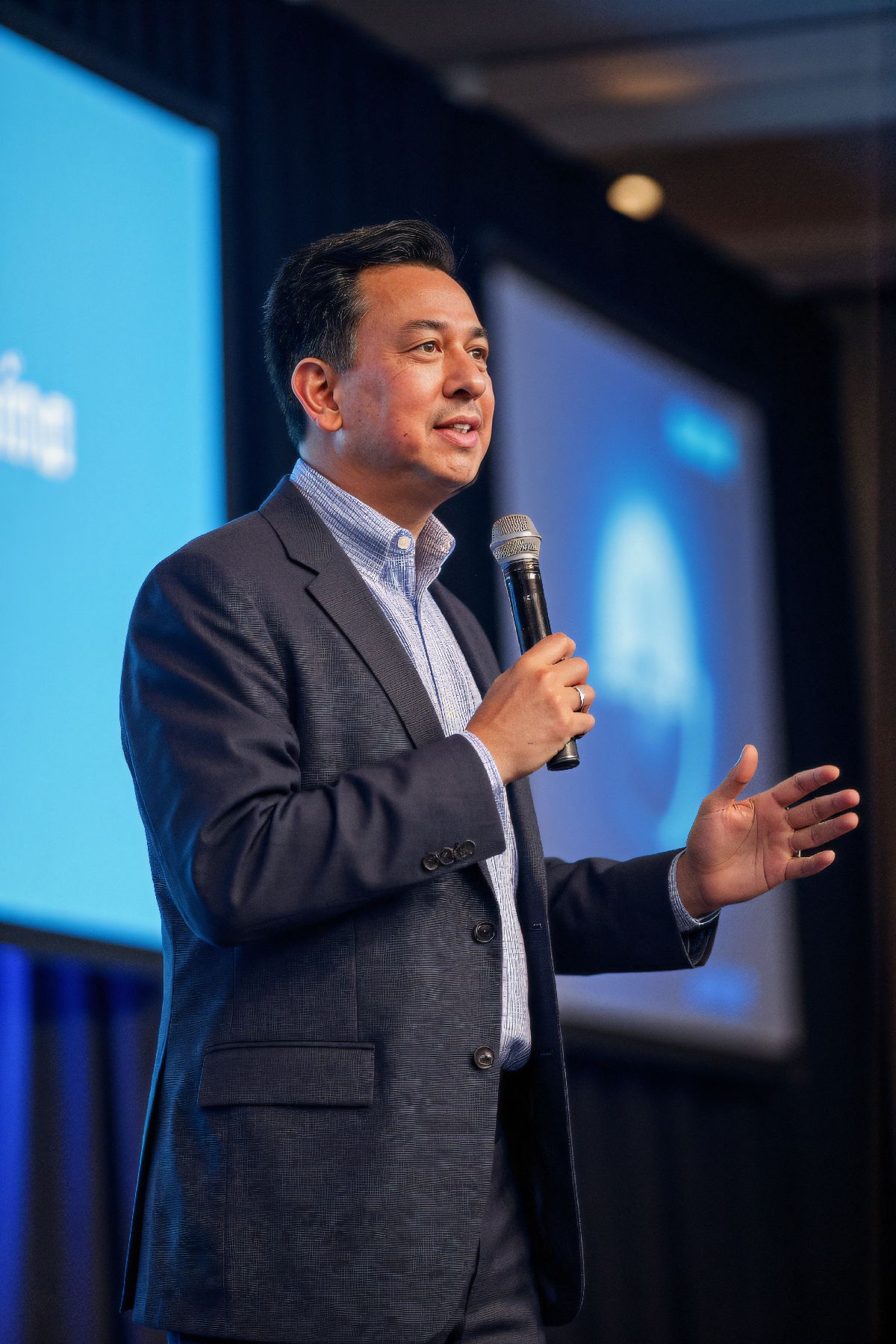 Dr. Peter Valenzuela speaking on stage